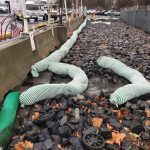 EnviroSoxx pollutant filter socks installed over riprap