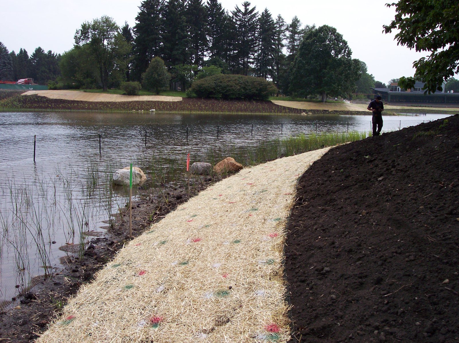 Rolled erosion control blankets installed on a slope